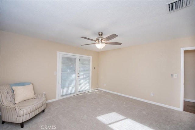 unfurnished room with light carpet and ceiling fan