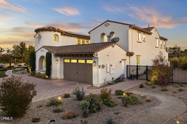 mediterranean / spanish-style house featuring a garage