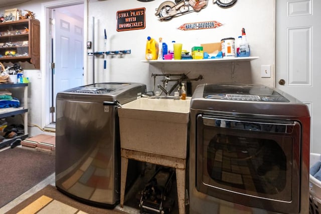 clothes washing area with separate washer and dryer