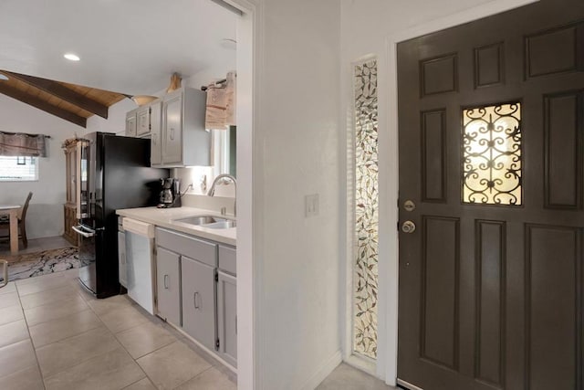 kitchen with dishwasher, lofted ceiling, sink, light tile patterned flooring, and wooden ceiling