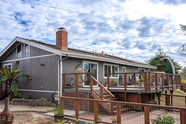 rear view of house with a deck