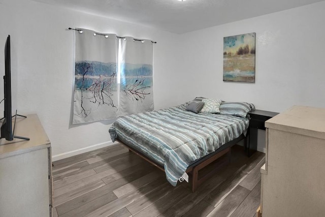 bedroom with hardwood / wood-style floors