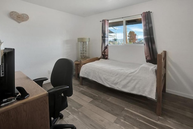 bedroom with wood-type flooring