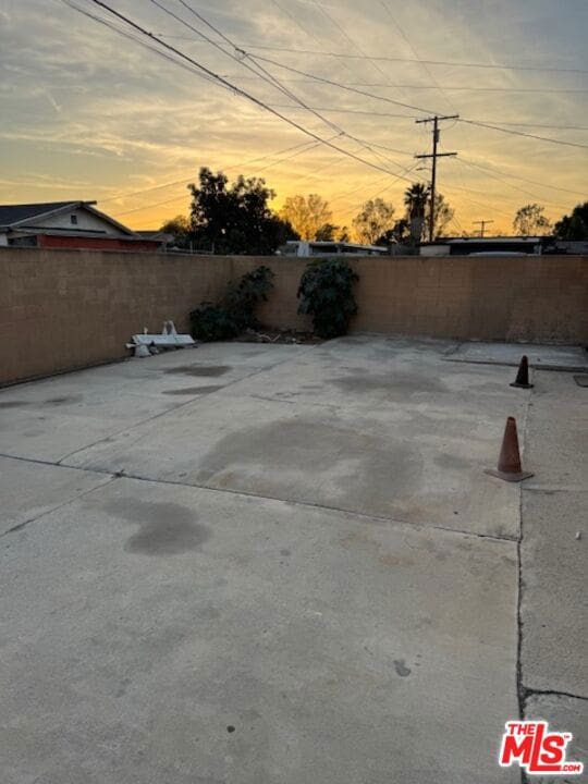 view of patio terrace at dusk