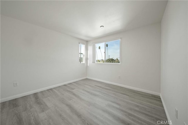 spare room featuring hardwood / wood-style floors