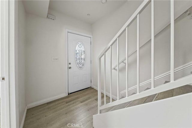 entryway with light hardwood / wood-style floors