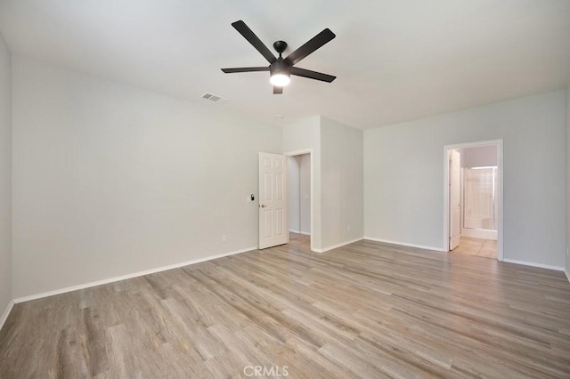 unfurnished room featuring ceiling fan and light hardwood / wood-style flooring