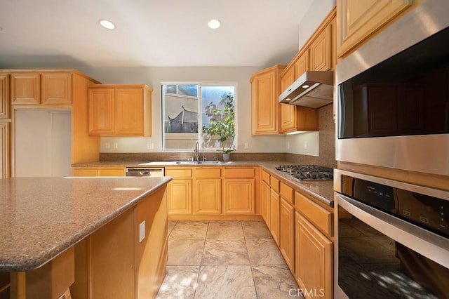 kitchen featuring light brown cabinets, sink, light stone countertops, appliances with stainless steel finishes, and extractor fan