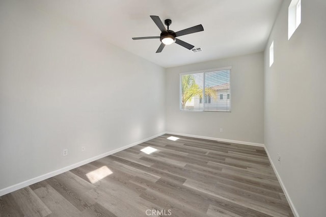 spare room featuring ceiling fan and hardwood / wood-style floors