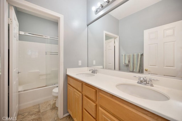 full bathroom with toilet, vanity, and combined bath / shower with glass door