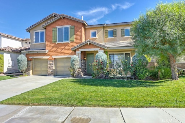 view of front of home with a front yard and a garage