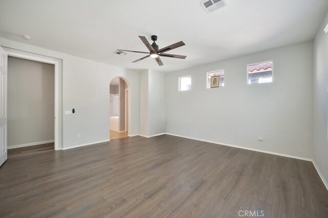 unfurnished room with dark hardwood / wood-style floors and ceiling fan