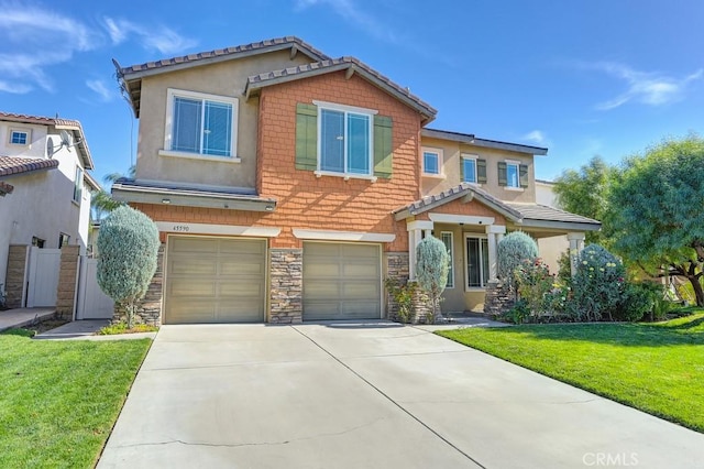 view of front of home with a garage and a front lawn