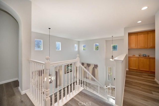 stairs featuring wood-type flooring