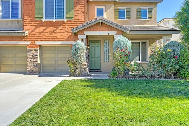 view of front facade with a garage and a front lawn