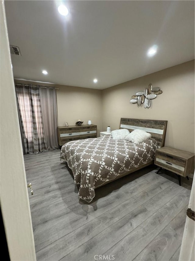 bedroom featuring light hardwood / wood-style floors