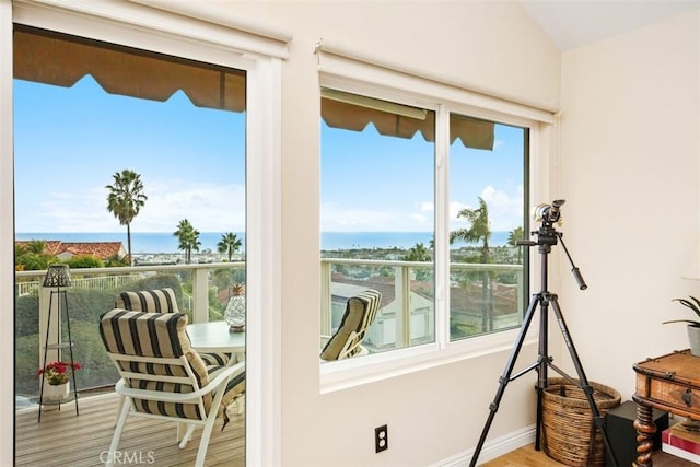 sunroom / solarium featuring a water view and a wealth of natural light