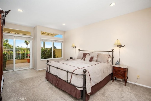 carpeted bedroom featuring access to exterior