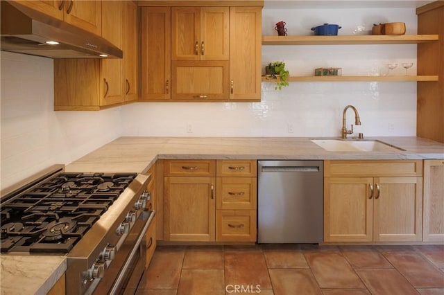 kitchen with decorative backsplash, sink, light stone countertops, and appliances with stainless steel finishes