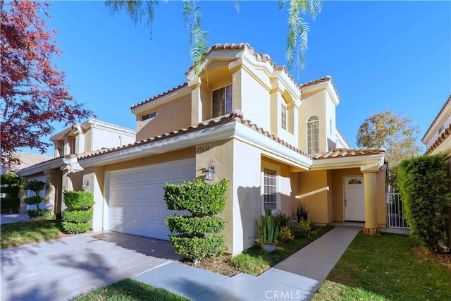 mediterranean / spanish home featuring a garage