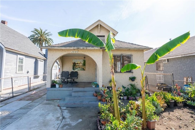 back of property with a patio