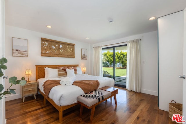 bedroom featuring dark hardwood / wood-style flooring and access to outside