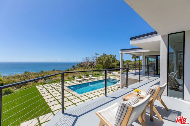 balcony featuring a water view