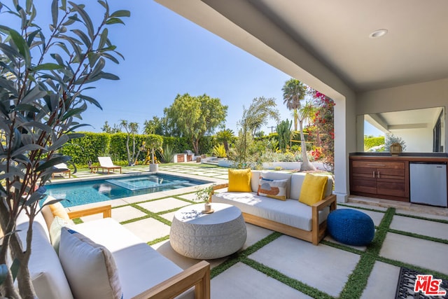 exterior space with an outdoor kitchen and a patio area