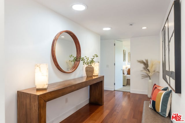 hall with dark wood-type flooring