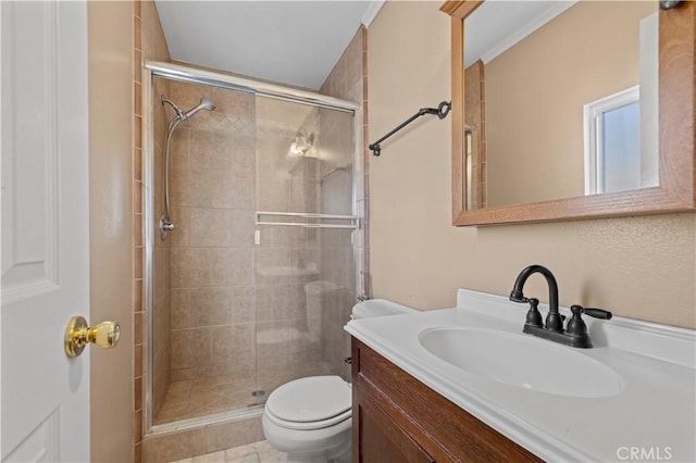 bathroom featuring toilet, vanity, and walk in shower