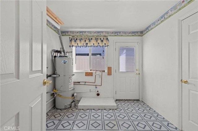 utility room featuring gas water heater