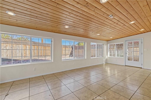 unfurnished sunroom with wood ceiling