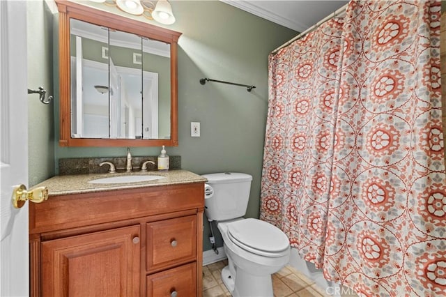 bathroom featuring tile patterned flooring, ornamental molding, vanity, and toilet