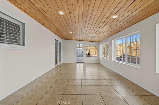 unfurnished sunroom with wood ceiling