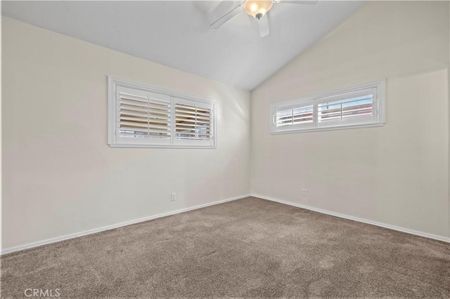 unfurnished room featuring ceiling fan, lofted ceiling, and carpet floors