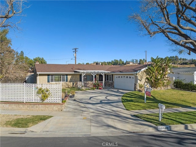 single story home featuring a garage, a front lawn, and a pergola