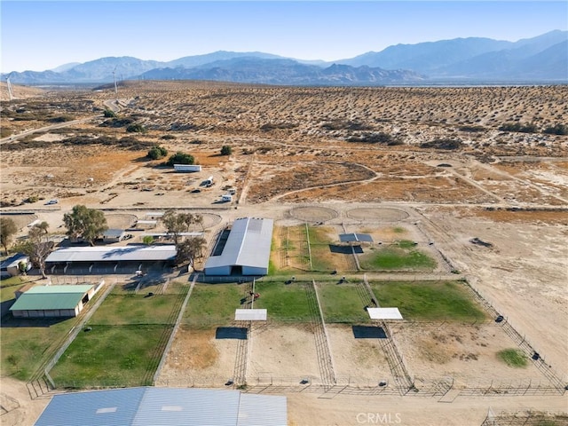 birds eye view of property with a mountain view