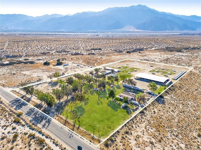 birds eye view of property featuring a mountain view