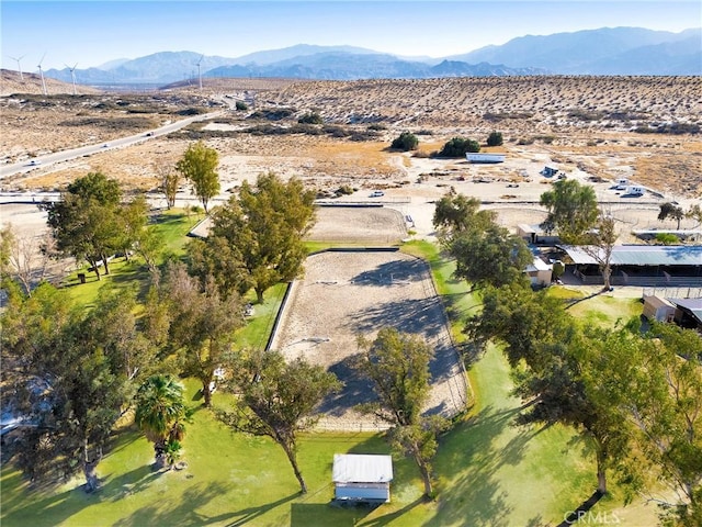 birds eye view of property with a mountain view