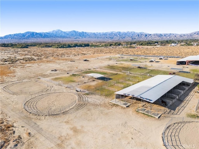 birds eye view of property featuring a mountain view