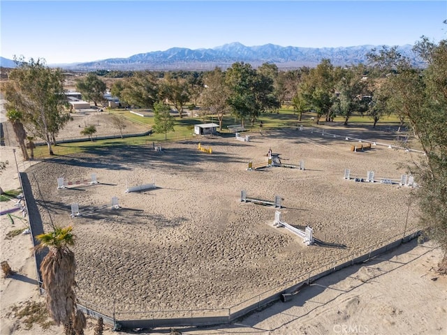 birds eye view of property with a mountain view