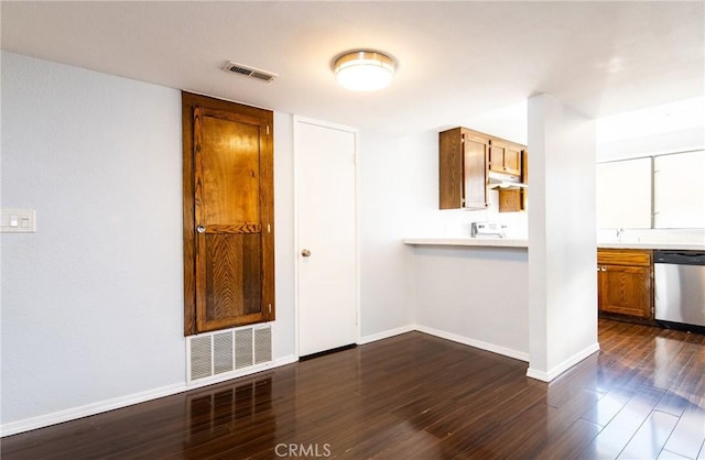 empty room with dark hardwood / wood-style flooring