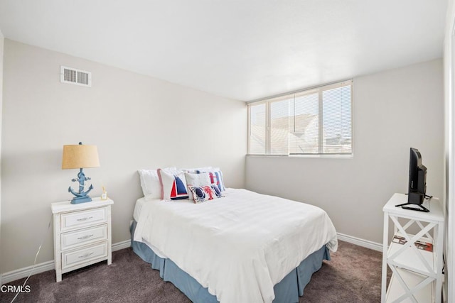 bedroom with dark carpet