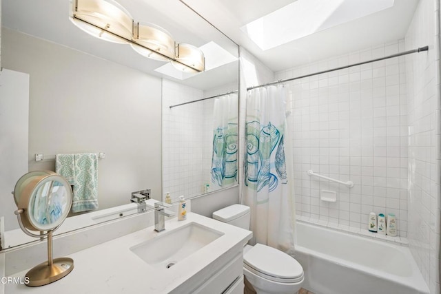 full bathroom featuring shower / bath combo, vanity, a skylight, and toilet