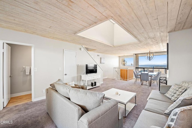 carpeted living room featuring a chandelier and wooden ceiling