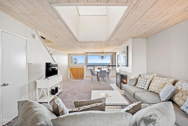 carpeted living room with wood ceiling