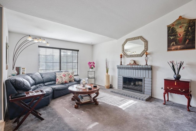 living room featuring carpet, vaulted ceiling, and a brick fireplace