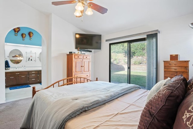 carpeted bedroom featuring access to outside, ensuite bath, ceiling fan, and lofted ceiling