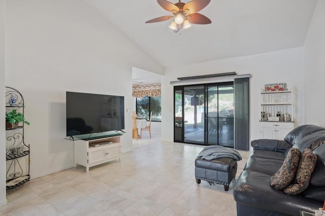 living room featuring ceiling fan and high vaulted ceiling