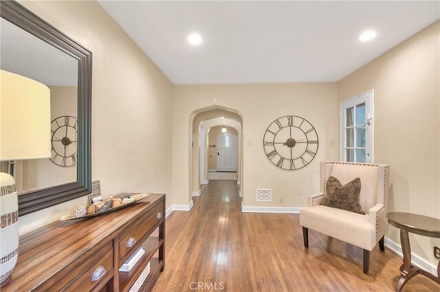 hall with dark hardwood / wood-style floors